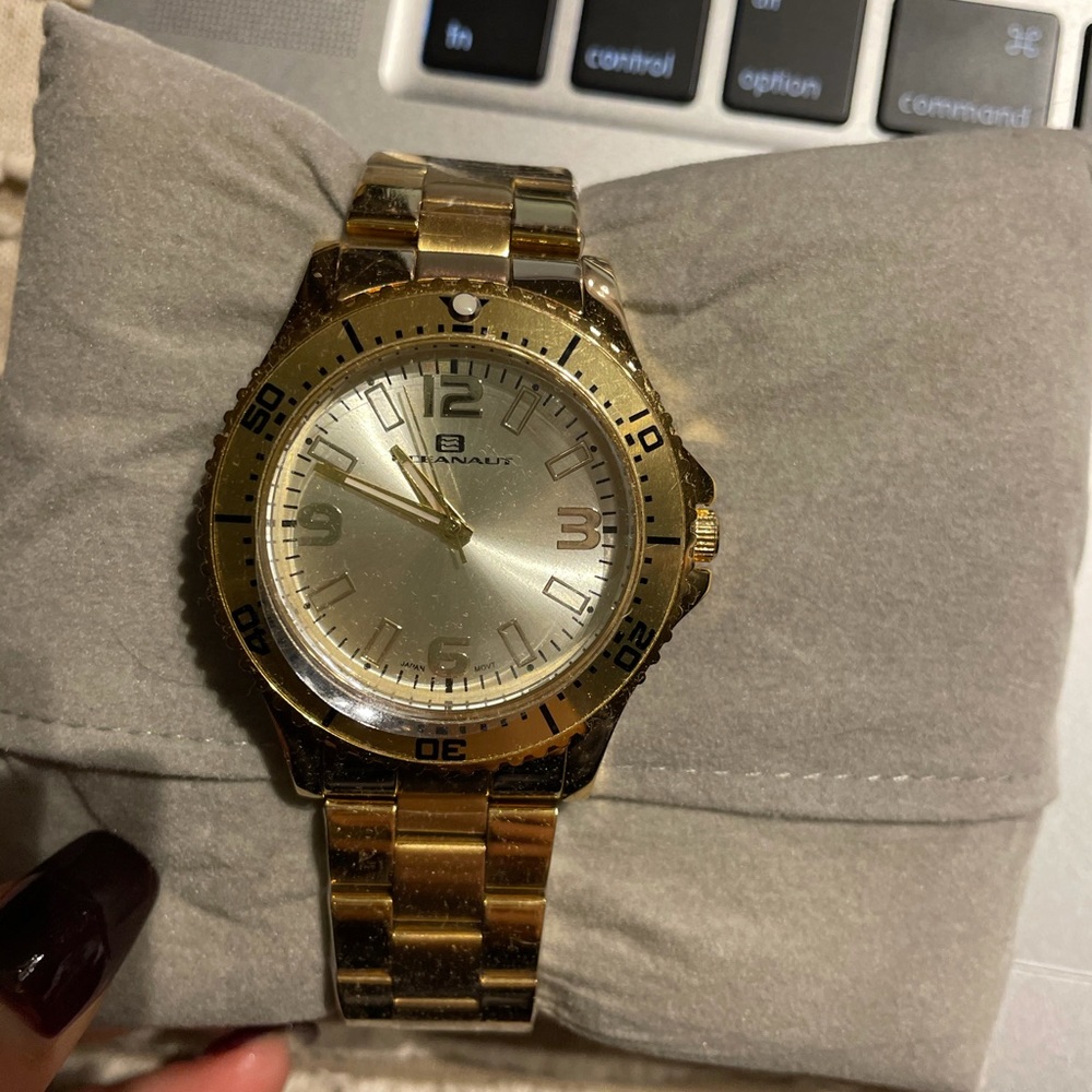 Never worn watch, plastic still on face and band